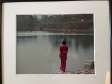 michael-rababy-woman-in-red-by-water-nepal